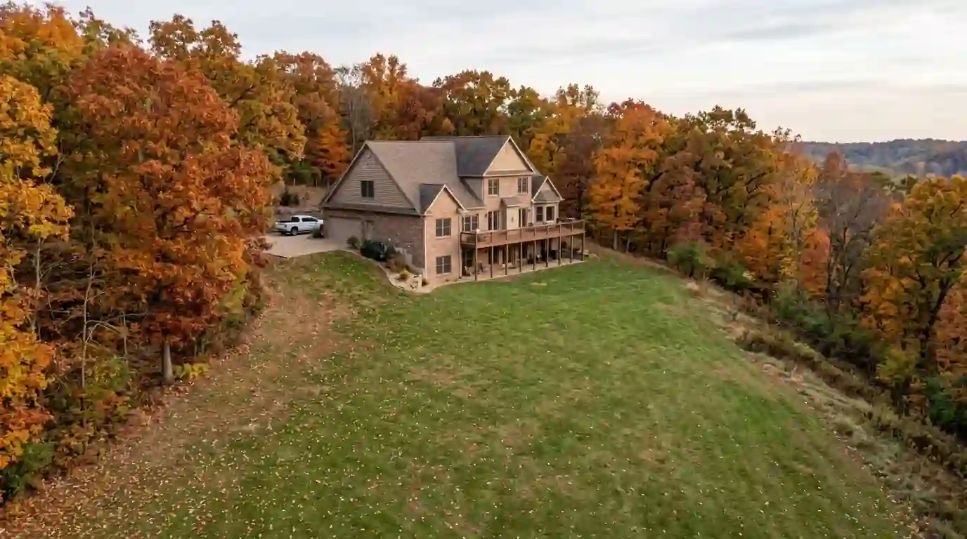 Columbia home on a wooded bluff lot in autumn